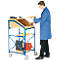 Man operates a blue, rolling tool cart with paper, tape and folders.
