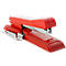 Red stapler on white background. Top view, lettering can be seen.