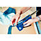 Person loading staples into a blue stapler. Pieces of fabric in the background.