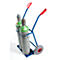 Two gas cylinders on a blue transport cart, red handles, gray wheel.