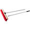 Broom with red bristle head and silver handle, black grip.