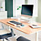 Un bureau moderne avec ordinateur, clavier, souris et bloc-notes. Une chaise est également visible.