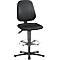 Black ergonomic swivel chair with backrest, seat, footrest, and base. Lever for height adjustment.