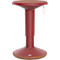 Tabouret debout rouge avec assise marron, lanière en cuir pour le transport.