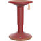Tabouret debout rouge, avec assise beige et poignée en cuir.