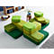 Modular green seating pads arranged in a playful configuration.