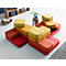 Multicoloured, square sofa parts are arranged in a living room.