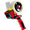 Red and black tape gun with warning sign and tape roll.