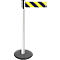 White queue post with a black base and a yellow and black striped barrier tape.