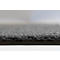 Gros plan sur une surface de tapis gris avec une structure de poils dense et texturée.