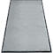 Tapis gris clair avec une bordure gris foncé. La surface est moelleuse.