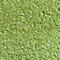 Gros plan sur un tapis vert clair avec une surface douce et inégale.