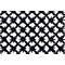 Gros plan d'un tapis noir en forme de grille avec des picots en forme d'étoile sur fond blanc.