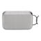 Grauer Bluetooth-Lautsprecher mit Stoffbezug, Metallrahmen und Bedienelementen.