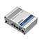 Grauer Router RUTX14 mit Anschlüssen, Beschriftungen und Firmenlogo. Aufschrift: TELTONIKA Networks.