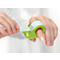 Person pulling tape from green ring dispenser attached to finger.