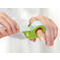 Person using a green tape dispenser attached to the finger. The tape is being pulled off.
