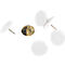 Close-up of white push pins with gold tips. Some lie flat, others are slightly angled.