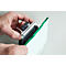 A hand holds a bracket for a glass plate with a green edge. The product is being assembled in the hand.