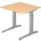 An adjustable height desk with a beige tabletop and silver frame. The tabletop is square.