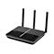 Schwarzer WLAN-Router mit drei Antennen, oben graues Muster, vorne Logo.
