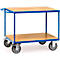 A blue serving cart with two wooden shelves. It has four wheels and a handle.