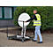 Man transports a white folding table on a transport cart. He is wearing a yellow vest.