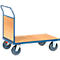 Blue-gray transport cart with wooden board and four wheels. Upright handle.