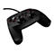 Manette de jeu noire avec des accents rouges et un câble. Boutons avec étiquettes : X, Y, B, Start. Deux joysticks. Logo TRUST.
