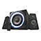 Schwarzes 2.1-Lautsprechersystem, zentraler Subwoofer mit blauem Lichtring, zwei Satellitenlautsprecher, Fernbedienung. Die Marke ist Trust.