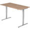 An adjustable height desk with a wooden top and silver legs. The legs are T-shaped.