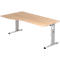Light brown desk with height-adjustable silver legs. The desk has a slightly curved shape.