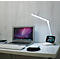 Witte bureau met laptop, toetsenbord, muis, lamp en smartphone met apps.