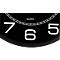 Detail of a black clock face with white numerals. The numbers 7, 6, and 5 are clearly visible. The word "QUARTZ" is also present.