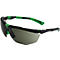 Lunettes de protection avec monture noire et accents verts. Les verres sont teintés en gris. Les lunettes sont en diagonale dans l'image.