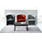 Three armchairs in gray and red in front of a wall. A gray coffee table with books sits on a gray rug.