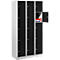 Cabinet with multiple compartments, one door open with contents. Black and white.