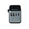 Grauer Verbatim Reiseadapter mit zwei USB-A- und zwei USB-C-Anschlüssen vor weißem Hintergrund.