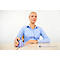 Blonde woman at a desk with an ergonomic mouse, looking upwards.
