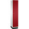 Armoire avec côté blanc et porte rouge. L'armoire repose sur une base noire. Un bouton sur la porte.