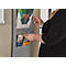 A woman opens a brochure compartment. Brochures with prints can be seen inside. The woman is wearing a black top.