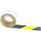 Rolled anti-slip tape roll. Black and yellow stripes. On a white background.