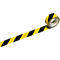 Yellow and black hazard tape unrolling from a roll.