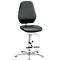 Office chair, black and white, ergonomic, with footrest.