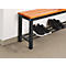 A shoe bench with a wooden top and black metal frame. Black shoes are on the shelves.