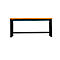 Workbench with a wooden top and black metal frame. It stands in front of a white background.