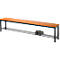 Wooden bench with black metal frame. Brown shoes rest on the shelf.