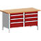 Workbench with red cabinet, light brown worktop and six drawers.