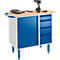 Workbench with blue doors and drawers, wooden worktop, tools.