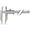 A silver caliper. Millimeters and inches are indicated on the scale. Text is shown on the right side of the ruler.